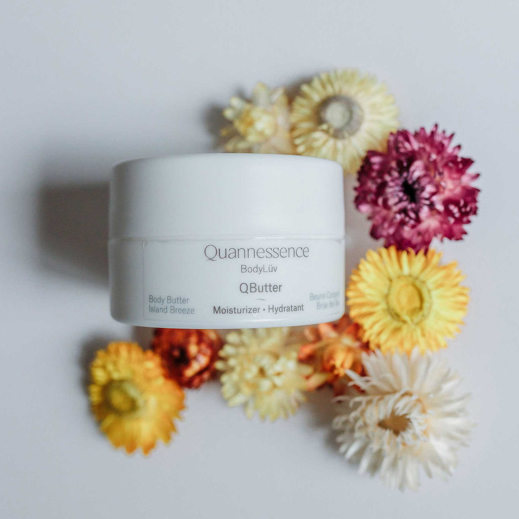 Quannessence Skincare, BodyLüv Collection, professional skincare, Holistic Beauty, Made in Canada, Naturally Sourced, Active ingredients, women-owned, Body, Cream, Moisturizer, QButter, Body Butter Cream, white jar with green plant display