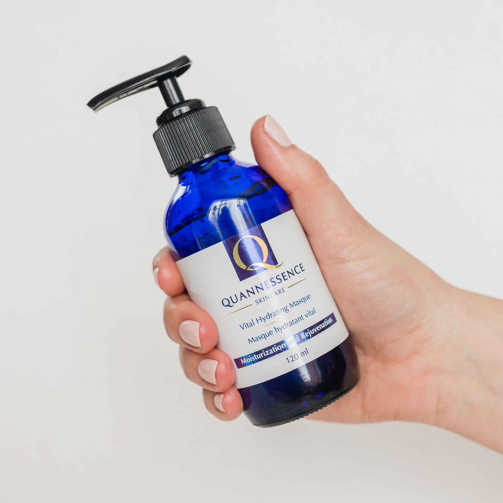 vital hydrating masque, Quannessence, made in Canada, skincare, beauty, holistic approach, Face, masque, blue bottle with pump, hand holding product