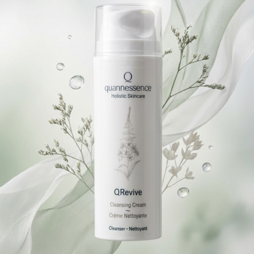 Quannessence QRevive Cleansing Cream bottle with floral elements on a light background. Quannessence Skincare, professional skincare, Holistic Beauty, Made in Canada, Naturally Sourced, Active ingredients, women-owned, Face, Cleanser, Cream, QRevive, Facial Cleansing Cream, white container with pump