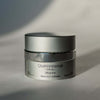 Skincare jar labeled 'Quannessence' on a neutral background.Quannessence Skincare, Infinity Collection, professional skincare, Holistic Beauty, Made in Canada, Naturally Sourced, Active ingredients, women-owned, Face, Moisturizer, Equinox, Equinox Age Renewal Cream, Silver packaging jar with silver lid