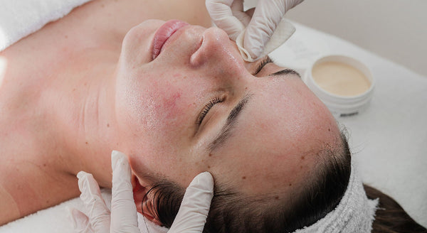 Professional peel pads being used during a facial treatment for the Quannessence exfoliating peel training grid image