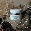 Quannessence Skincare, professional skincare, Holistic Beauty, Made in Canada, Naturally Sourced, Active ingredients, women-owned, Face, Moisturizer, Lotion, Cream, QNourish, uniQue encapsulated Vitamin Lotion, white jar, hand with cream