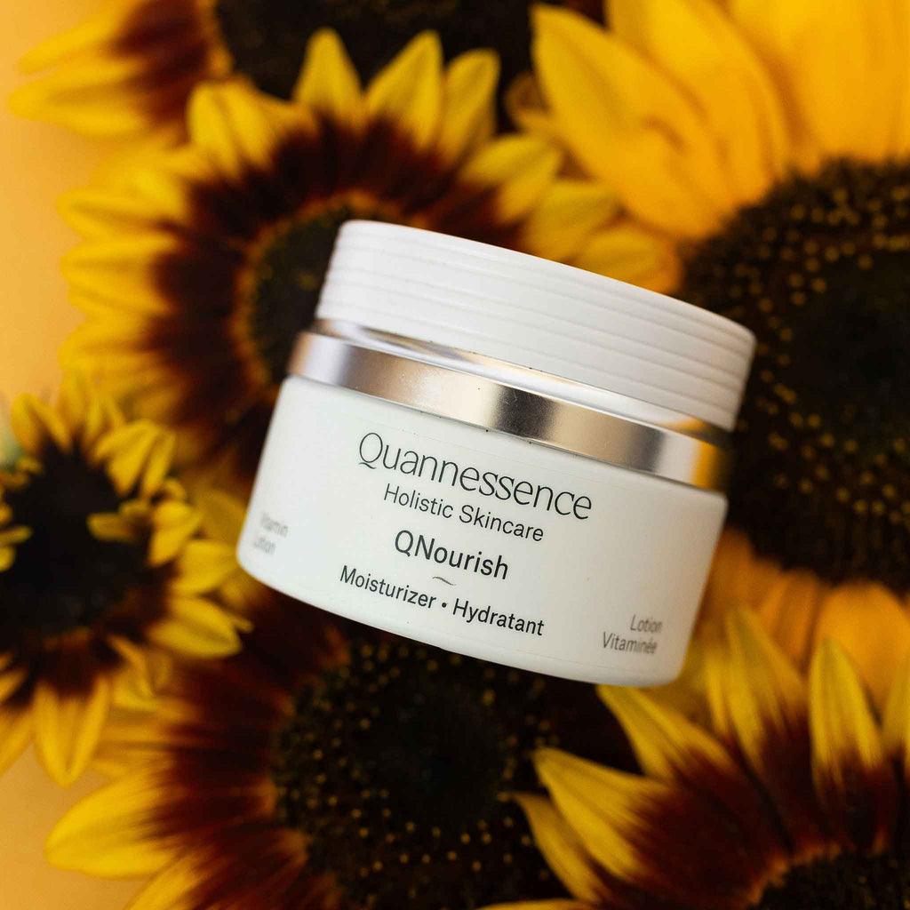 Quannessence Skincare, professional skincare, Holistic Beauty, Made in Canada, Naturally Sourced, Active ingredients, women-owned, Face, Moisturizer, Lotion, Cream, QNourish, uniQue encapsulated Vitamin Lotion, white jar, hand with cream