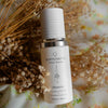 QHyaluron Hydrating Complex by Quannessence, Skincare serum bottle with 'quannessence' branding on a floral background. Quannessence Skincare, professional skincare, Holistic Beauty, Made in Canada, Naturally Sourced, Active ingredients, women-owned, Face, Serum, QHYaluron, Hyaluronic (PUR) Hydrating Serum, white glass packaging with white lid & pump